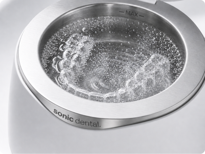 Microscopic bubbles surrounding an appliance in an ultrasonic cleaner